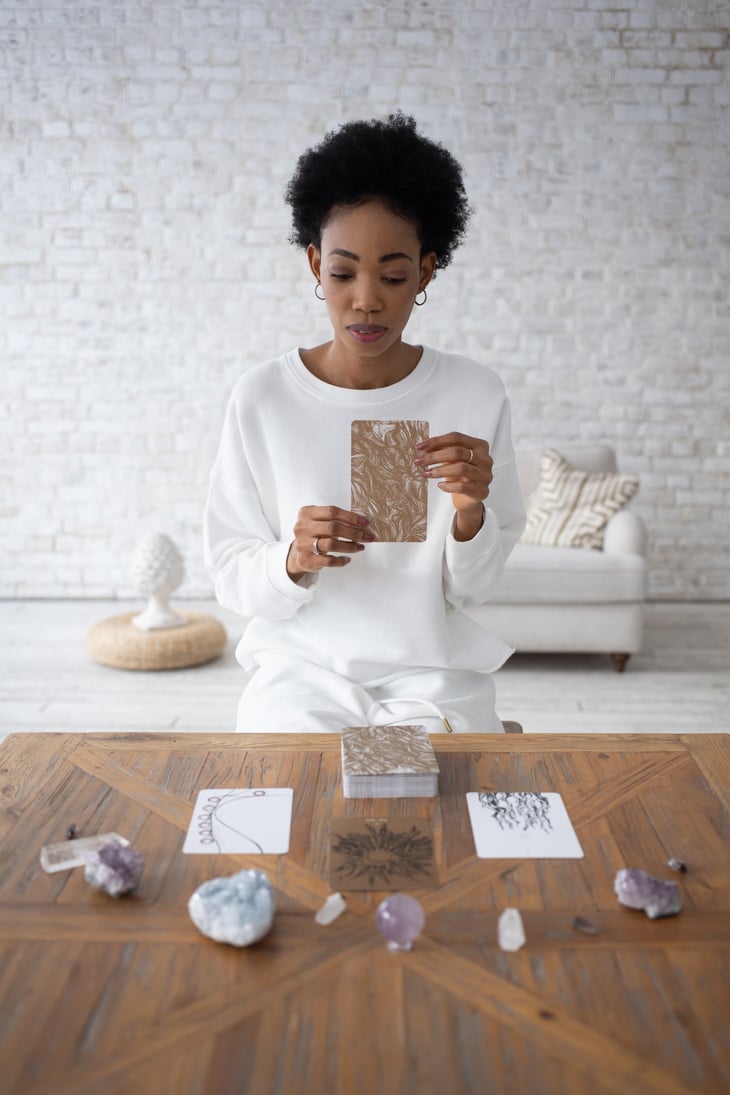 A Woman Sitting with Tarot Cards